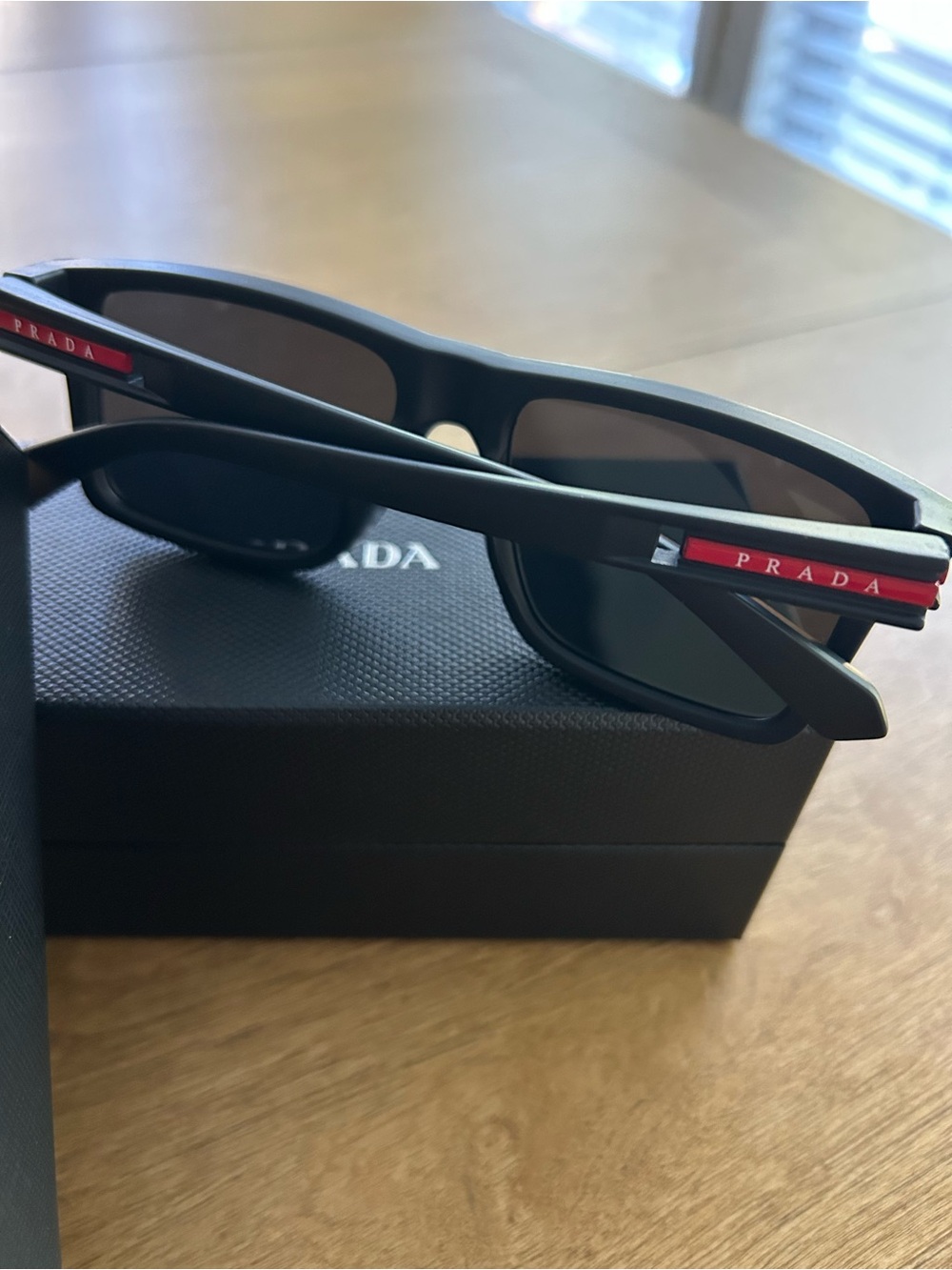 Prada Black Square Sunglasses with Subtle Red Accent - Picture 2 of 4